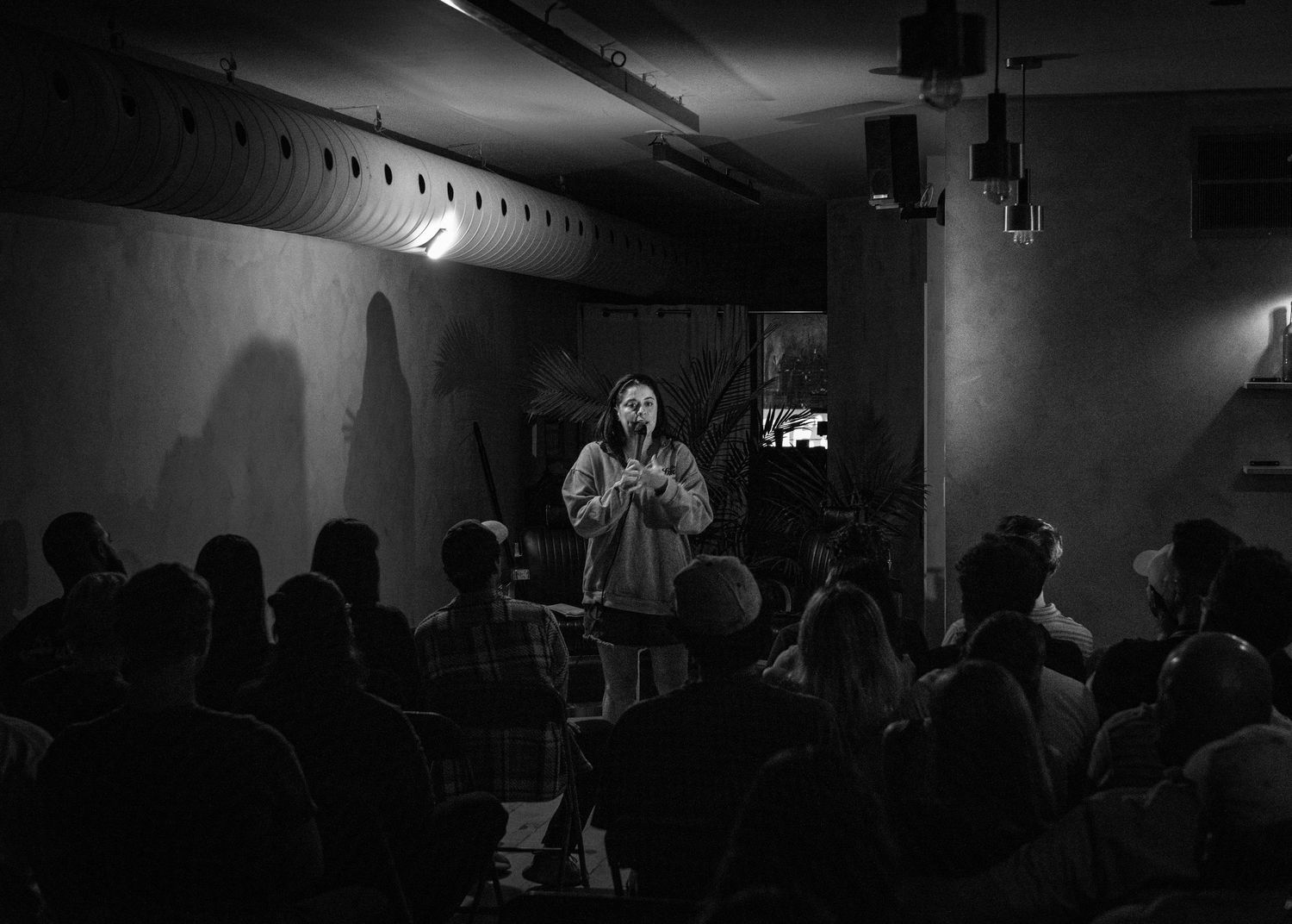 Event photography capturing live moments from the 'Mess Produced' comedy show with performers on stage