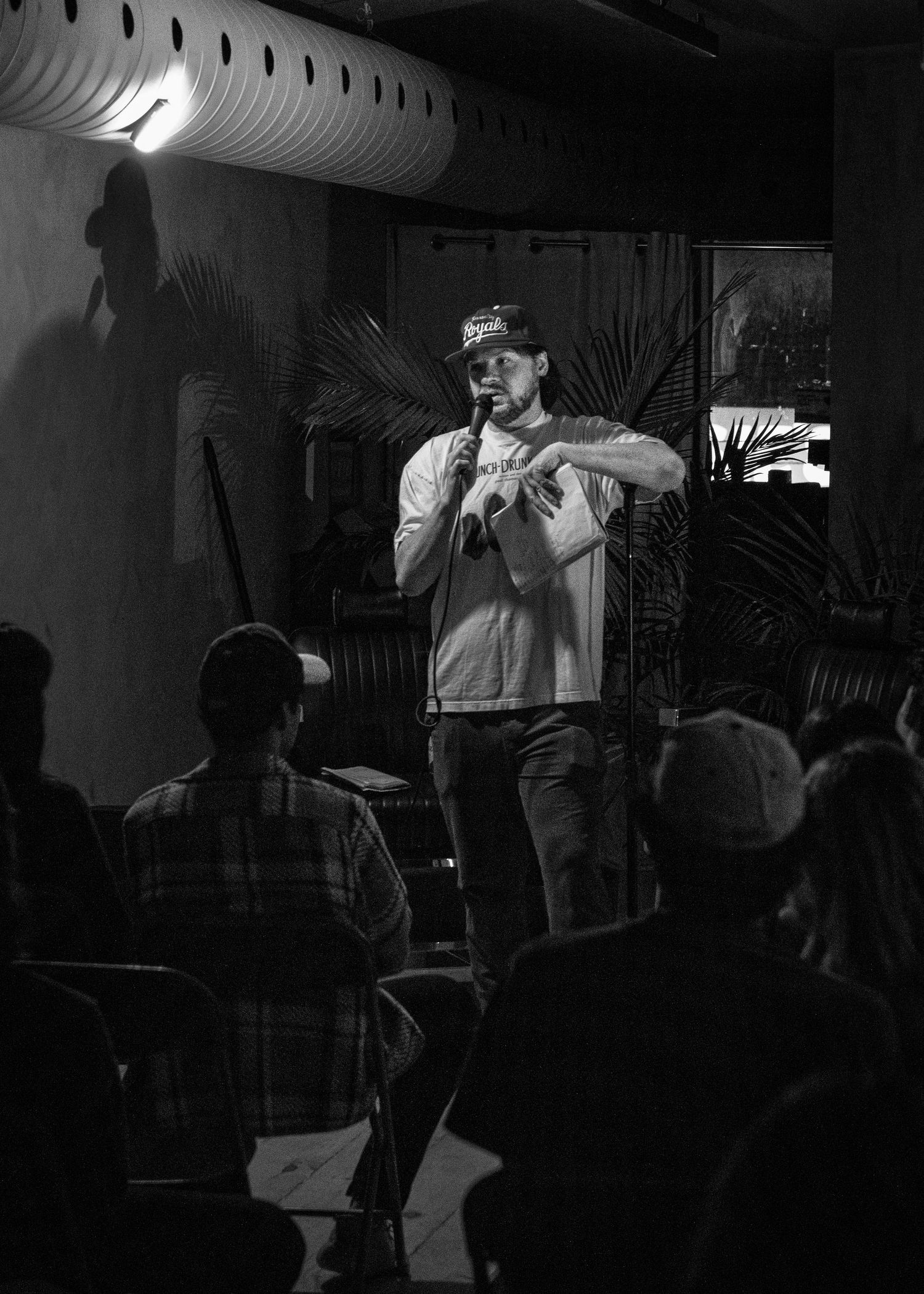 Event photography capturing live moments from the 'Mess Produced' comedy show with performers on stage