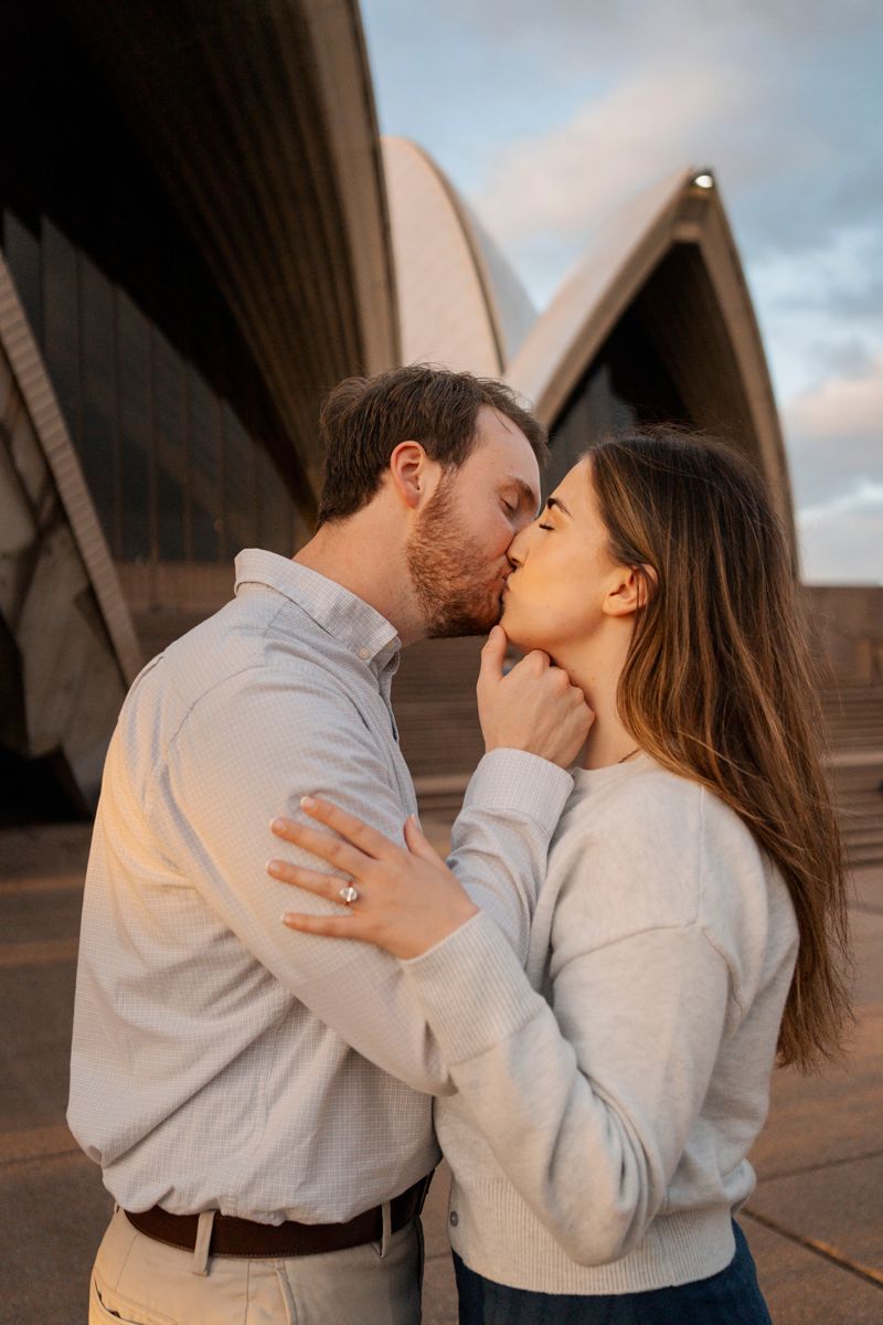 man romantically kisses his girlfriend during an engagement photography session in Sydney with the golden sun light
