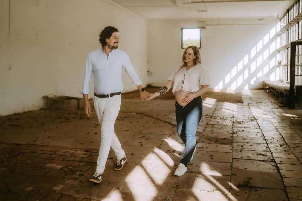 Light-filled vintage space with people dancing in sunbeams.