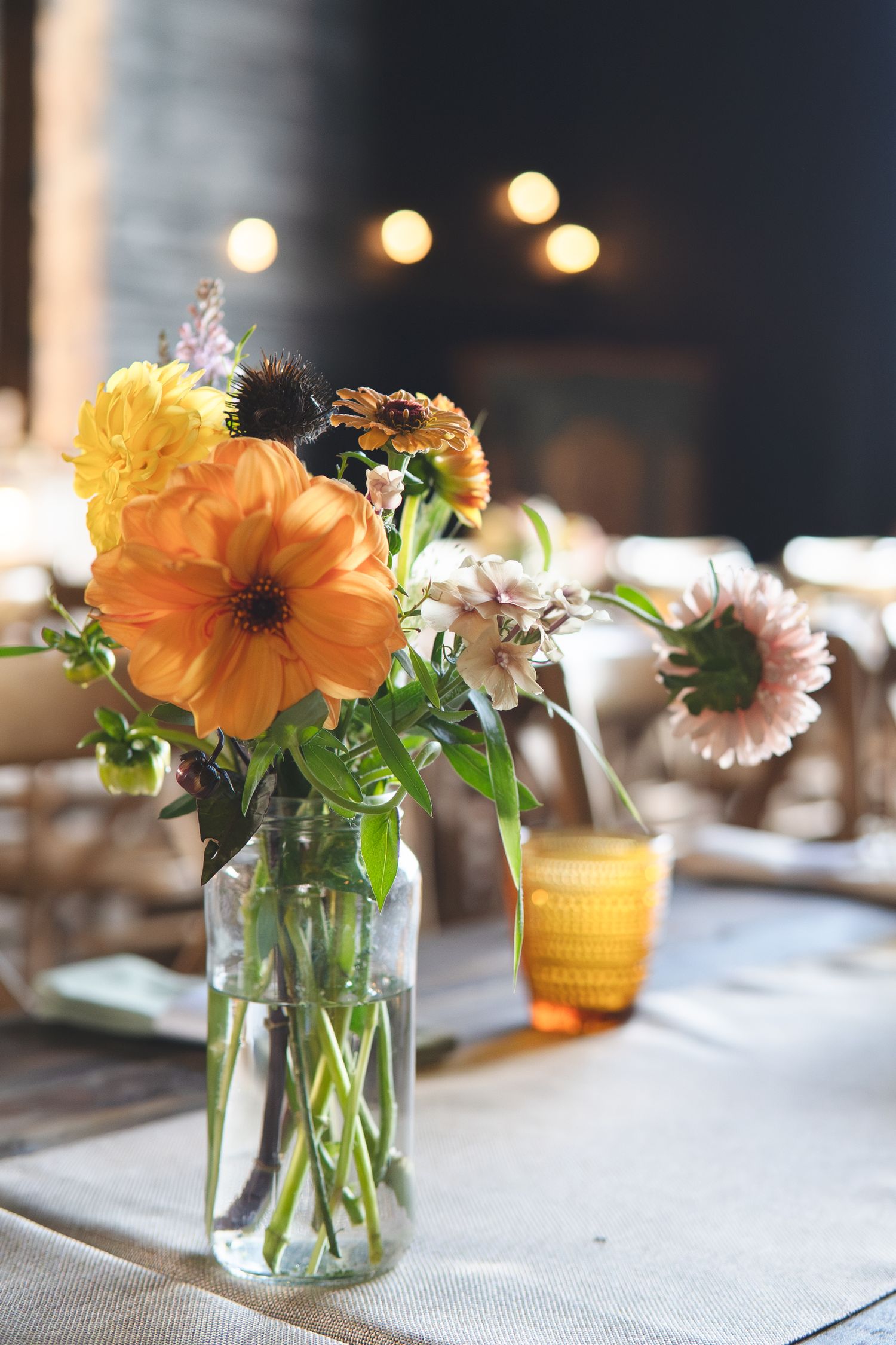 Jars of locally grown blooms from a flower grower in Kent | Flowers created by BLOOM Fabulous | A Kentish wedding