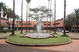 luxury garden wedding venue in Nairobi, captured by Nairobi Wedding Photographer, Bonnie Gichuru, showcasing lush greenery and flower arches