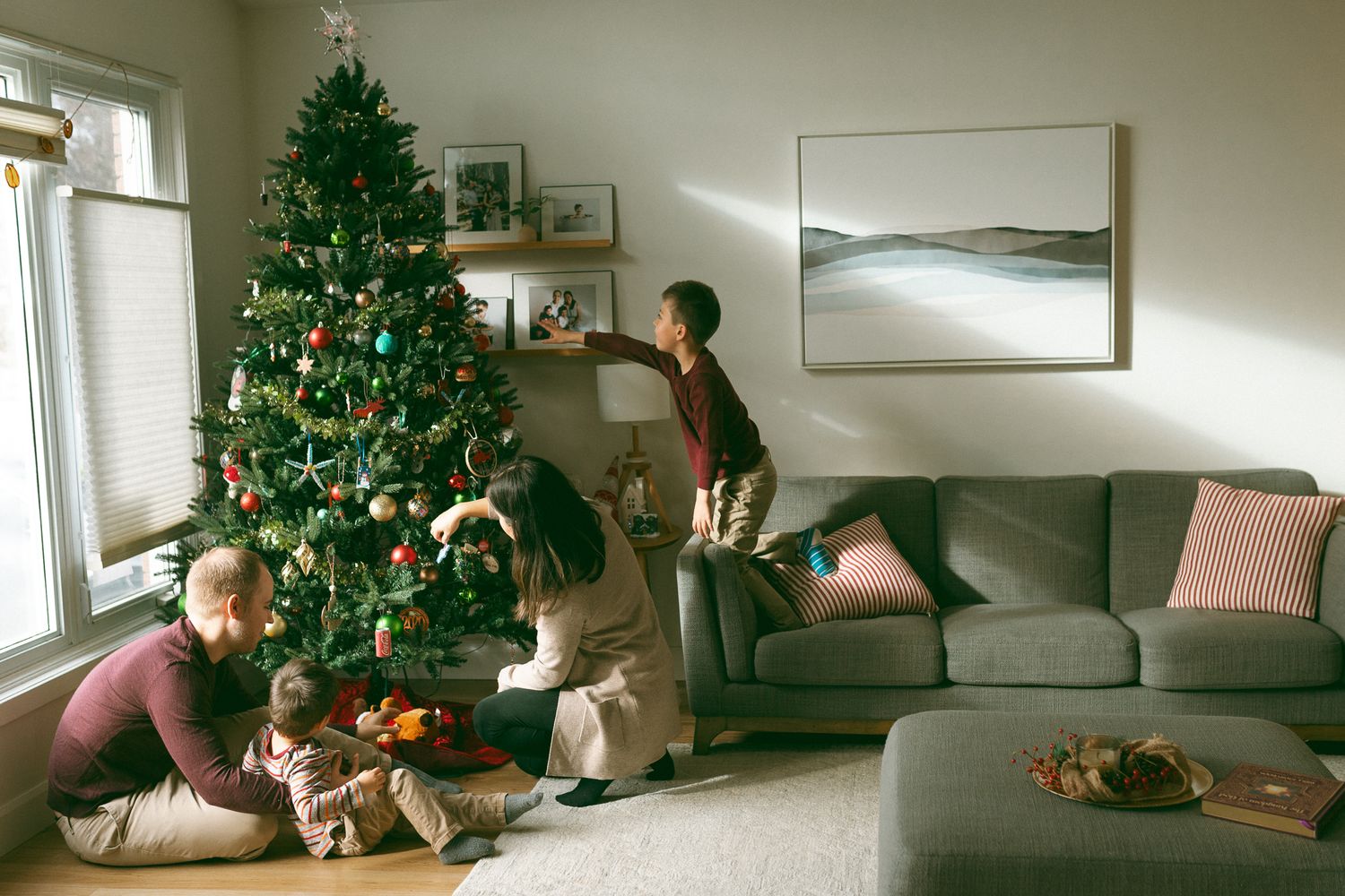 Decorate the tree during your in-home Christmas session in Kingston Ontario