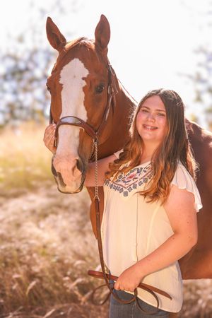 A series of warm sunlit photos showing a chestnut horse with white markings and rider in an outdoor setting.