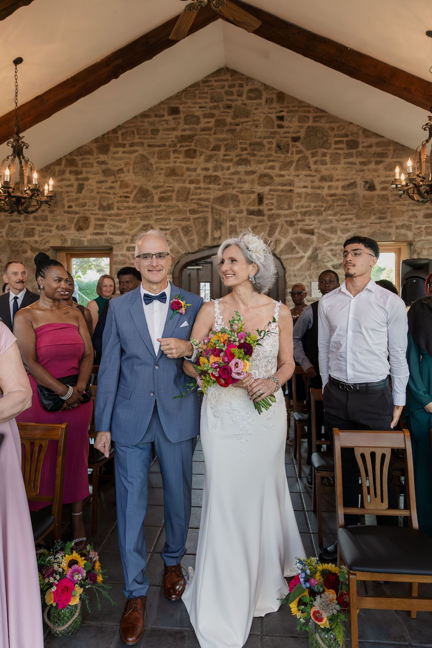 Bride and groom walk into their ceremony together at the Carriage House at Vineland Estates Winery.