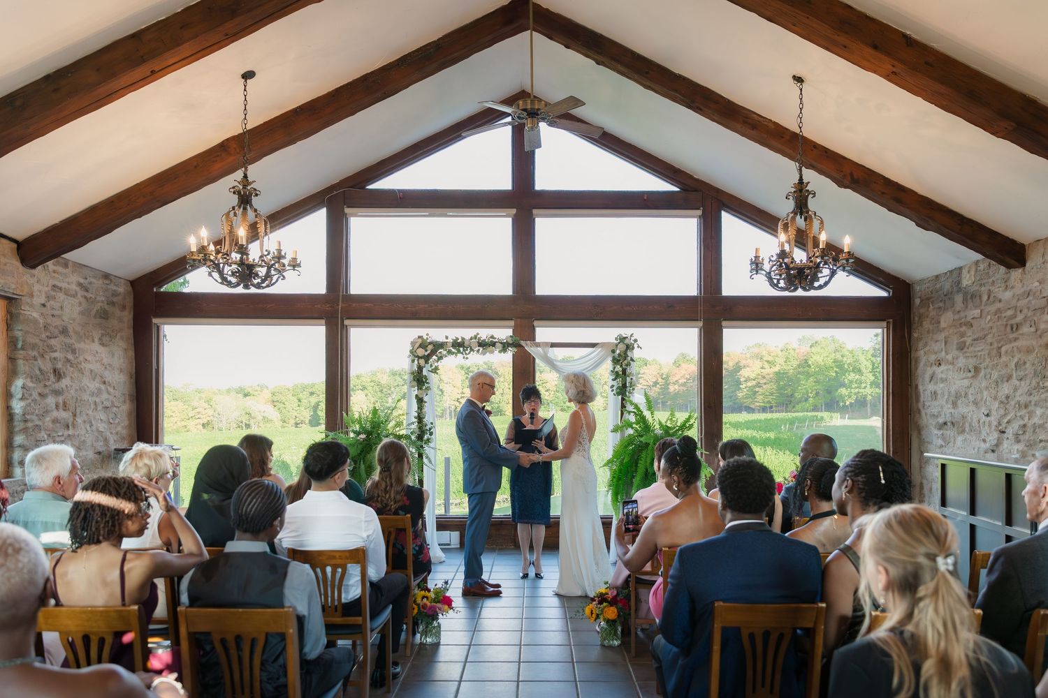 Panoramic view of the Carriage House ceremony set up overlooking the vineyards at Vineland Estates Winery.