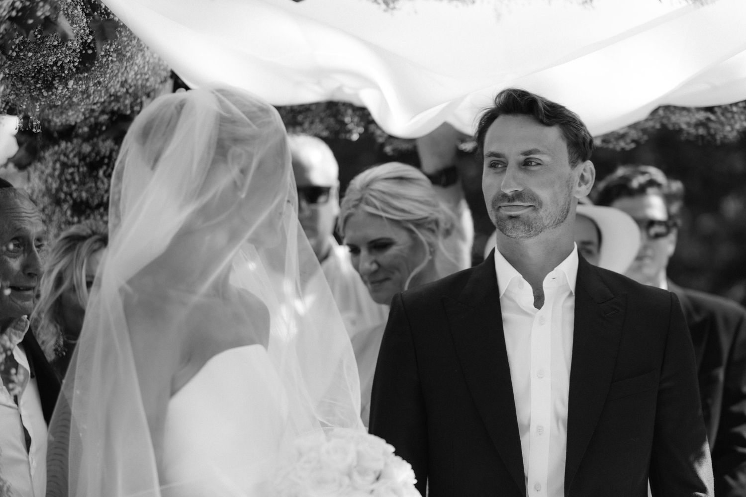 A series of black and white wedding photos showing couples celebrating their special day outdoors.