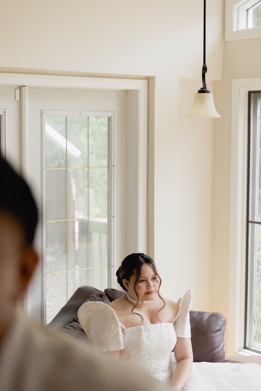 A bride waiting for her groom during a first look at an Okanagan wedding, taken by Kristina Harnett.