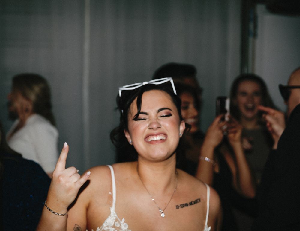 A bride celebrating her wedding reception after party in Vancouver, B.C., taken by Kristina Harnett.