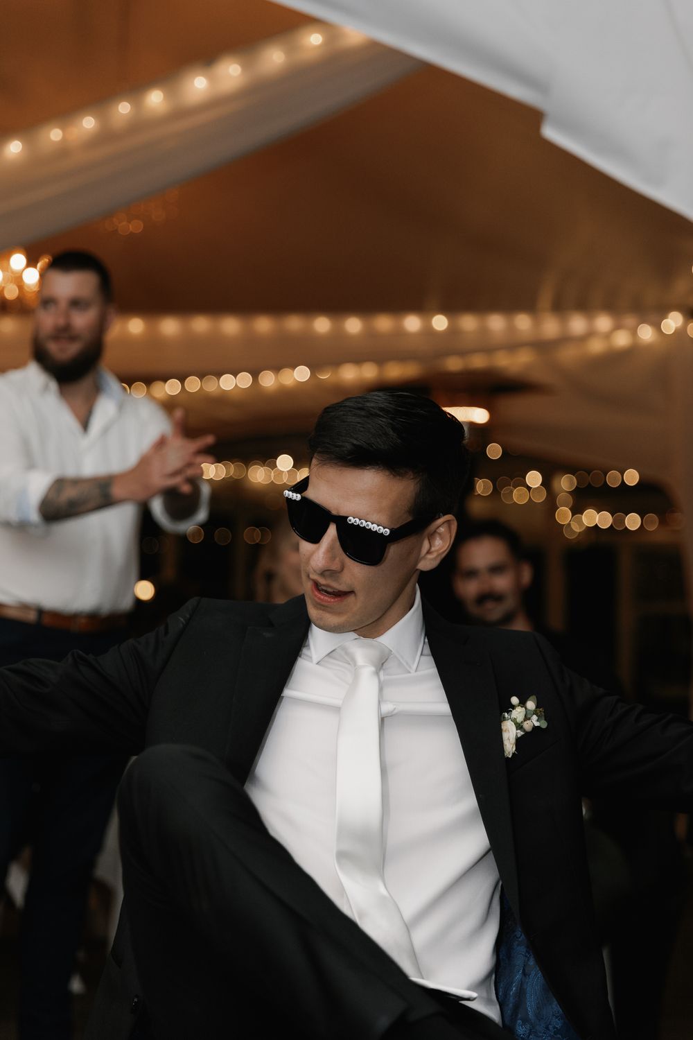 A groom having a great time celebrating his Vancouver wedding during the reception after party, taken by Kristina Harnett.