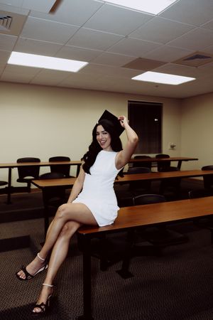 Dynamic poses in a classroom with tiered seating and fluorescent lighting.