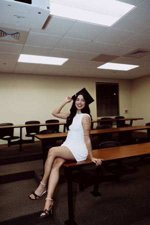A series of photos showing someone posing playfully in a classroom with desks and fluorescent lighting.