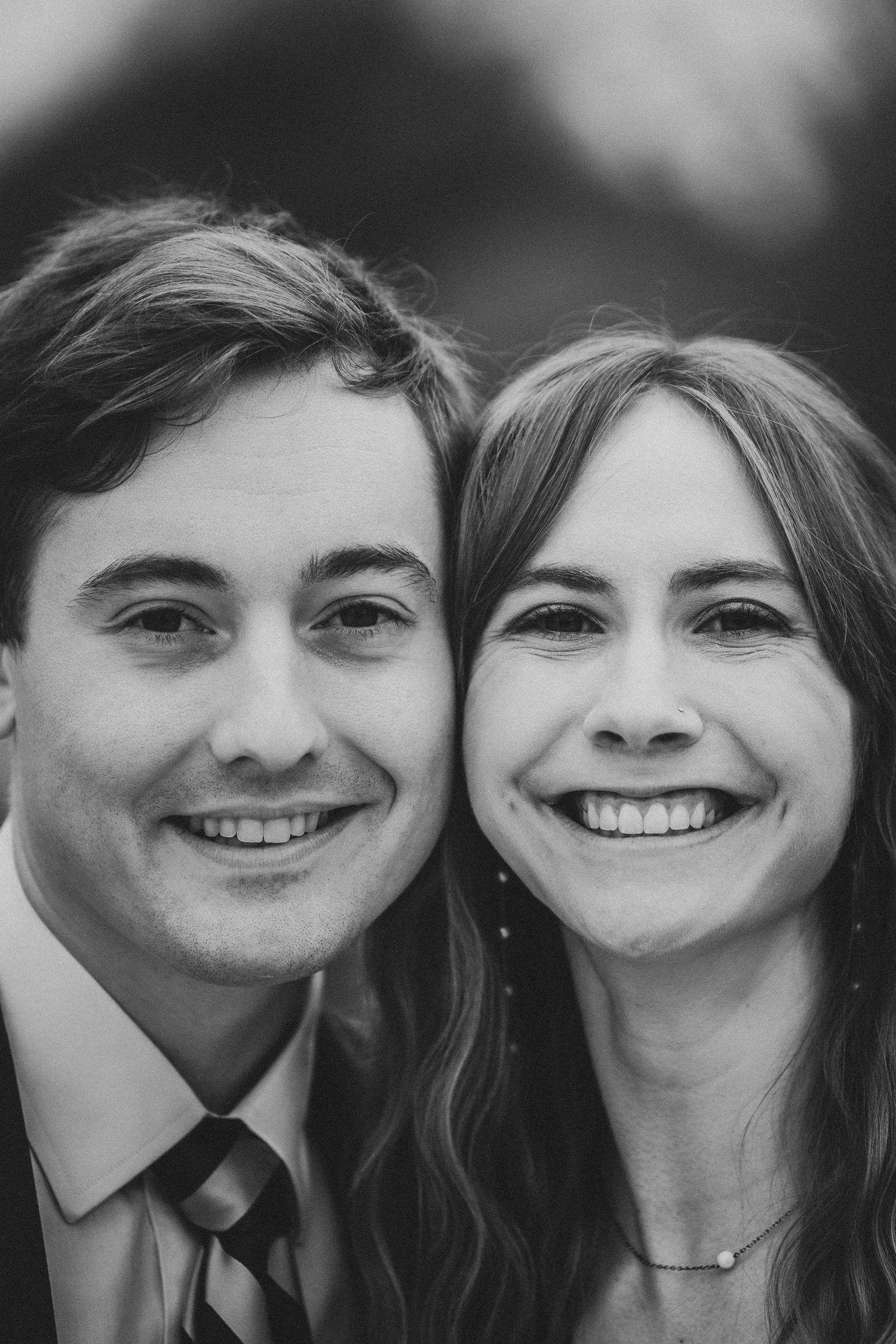 A black and white photo sequence shows a couple smiling and getting closer together in four progressive shots.