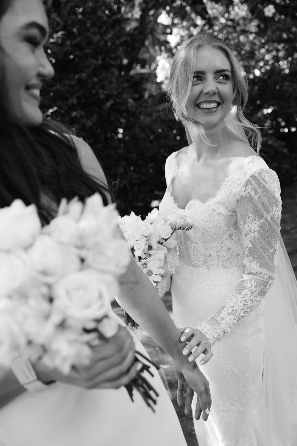 A series of candid wedding photos showing joyful moments with white floral bouquets and lace details in natural lighting.