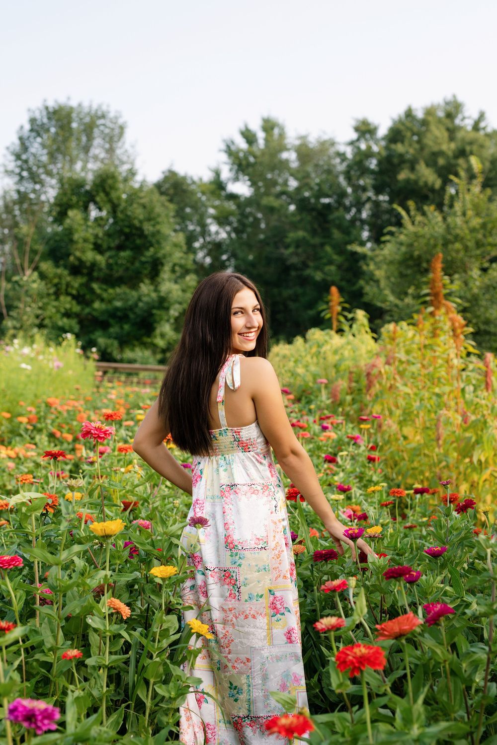 High school senior photography among colorful flowers during summer mini sessions at First Roots Flower Farm in Oconomowoc, Wisconsin.
