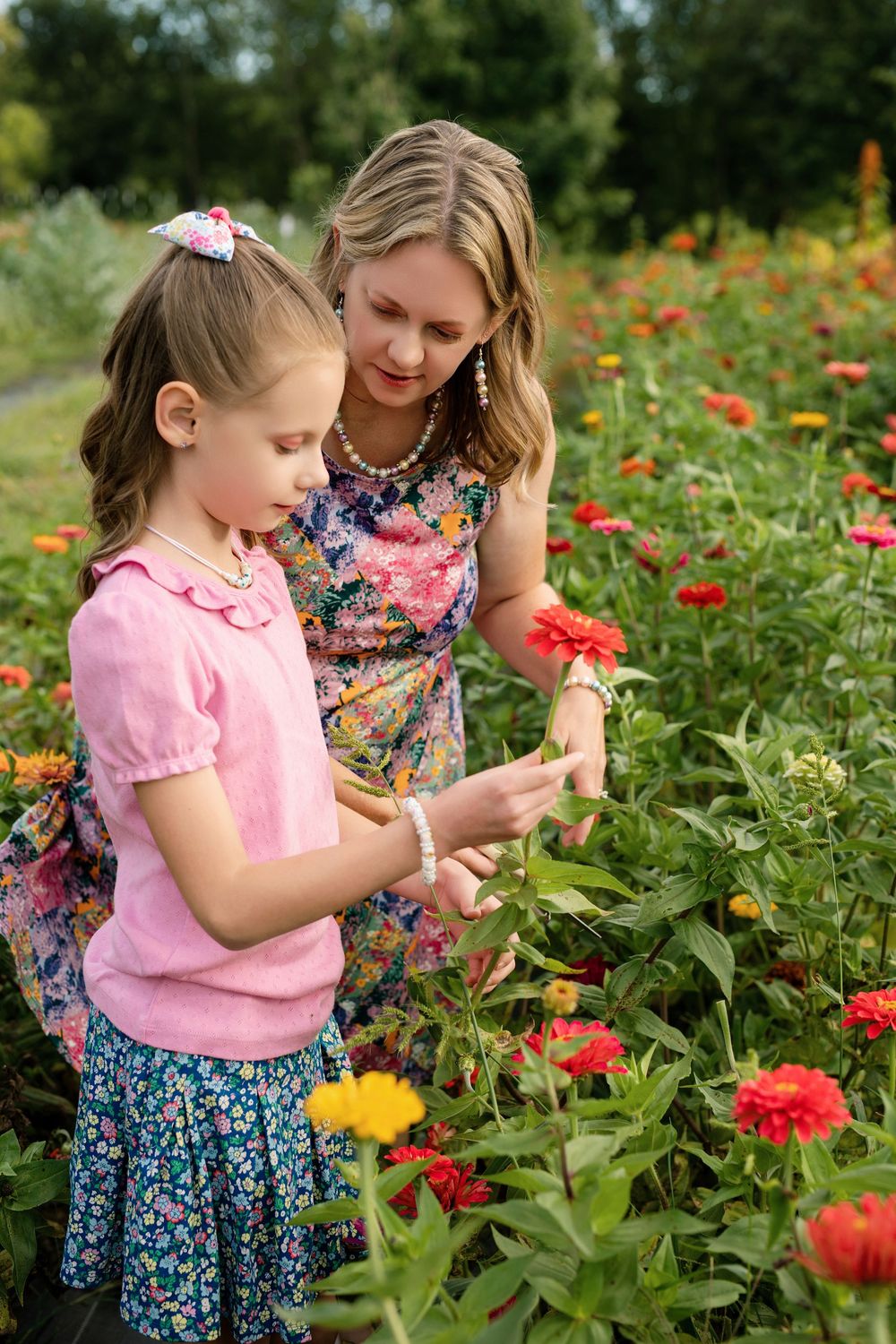 Parents and children picking flowers together during U-pick family mini sessions at First Roots Flower Farm in Oconomowoc, Wisconsin.
