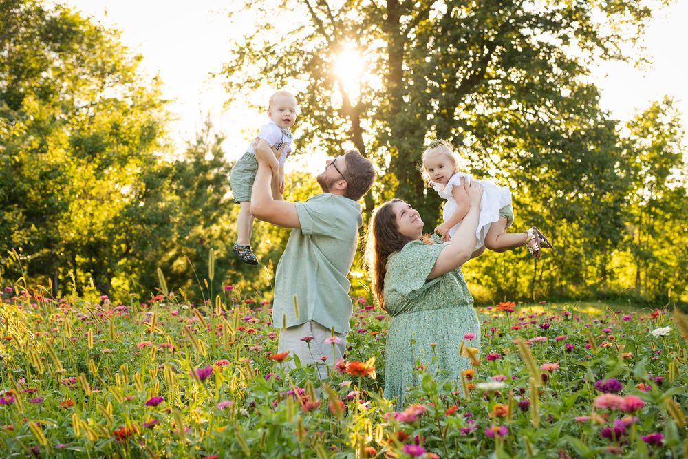 Family photos among colorful flowers during summer mini sessions at First Roots Flower Farm in Oconomowoc, Wisconsin.