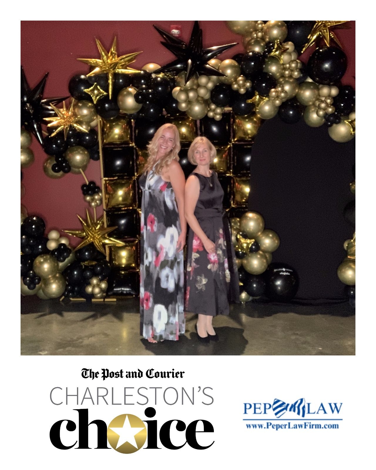 Two people sit on a bench in front of a decorated Christmas tree with gold ornaments and star decorations.
