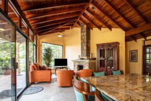 Terrace with a lounge area, orange sofas, and a panoramic view of the landscape
