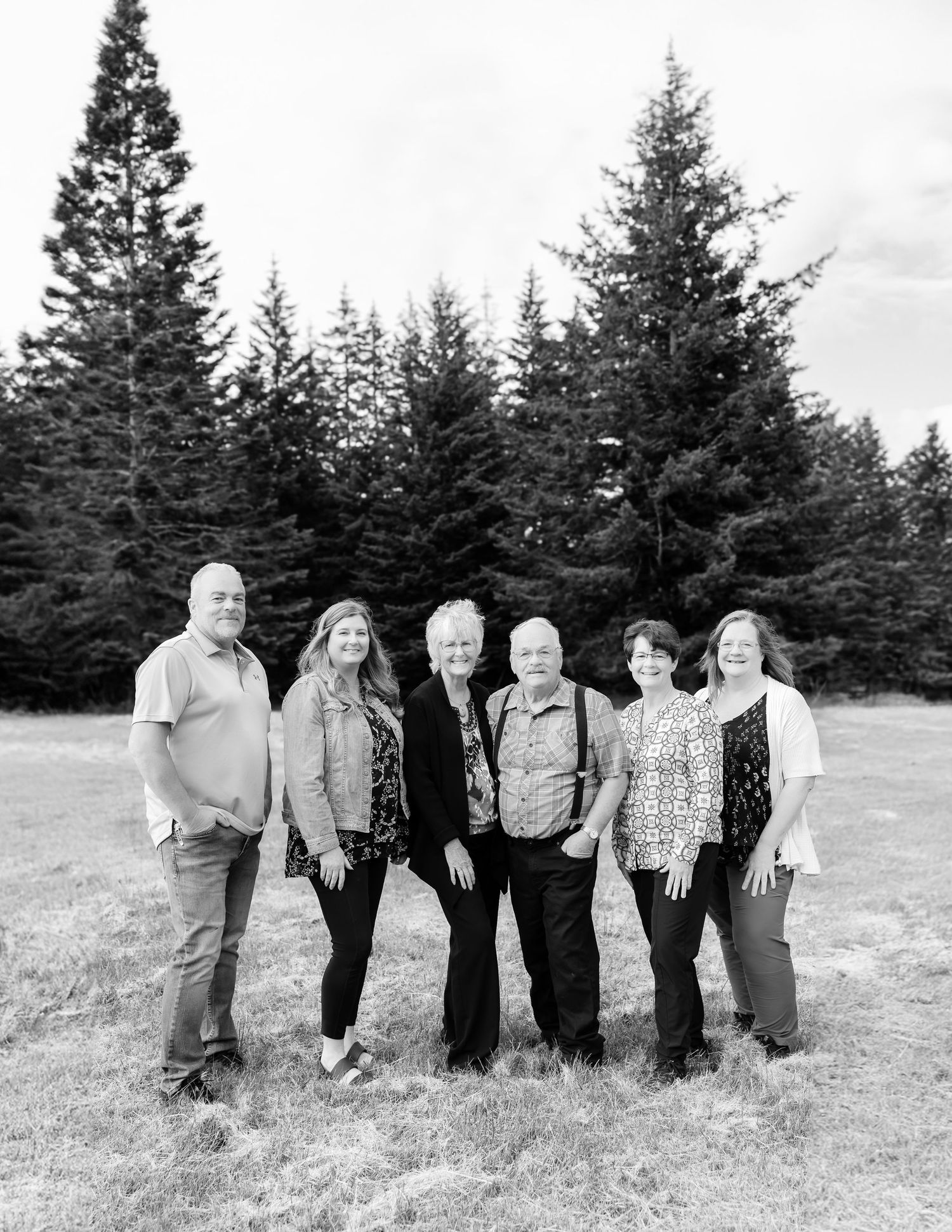 Beautiful black and white family portrait in a field