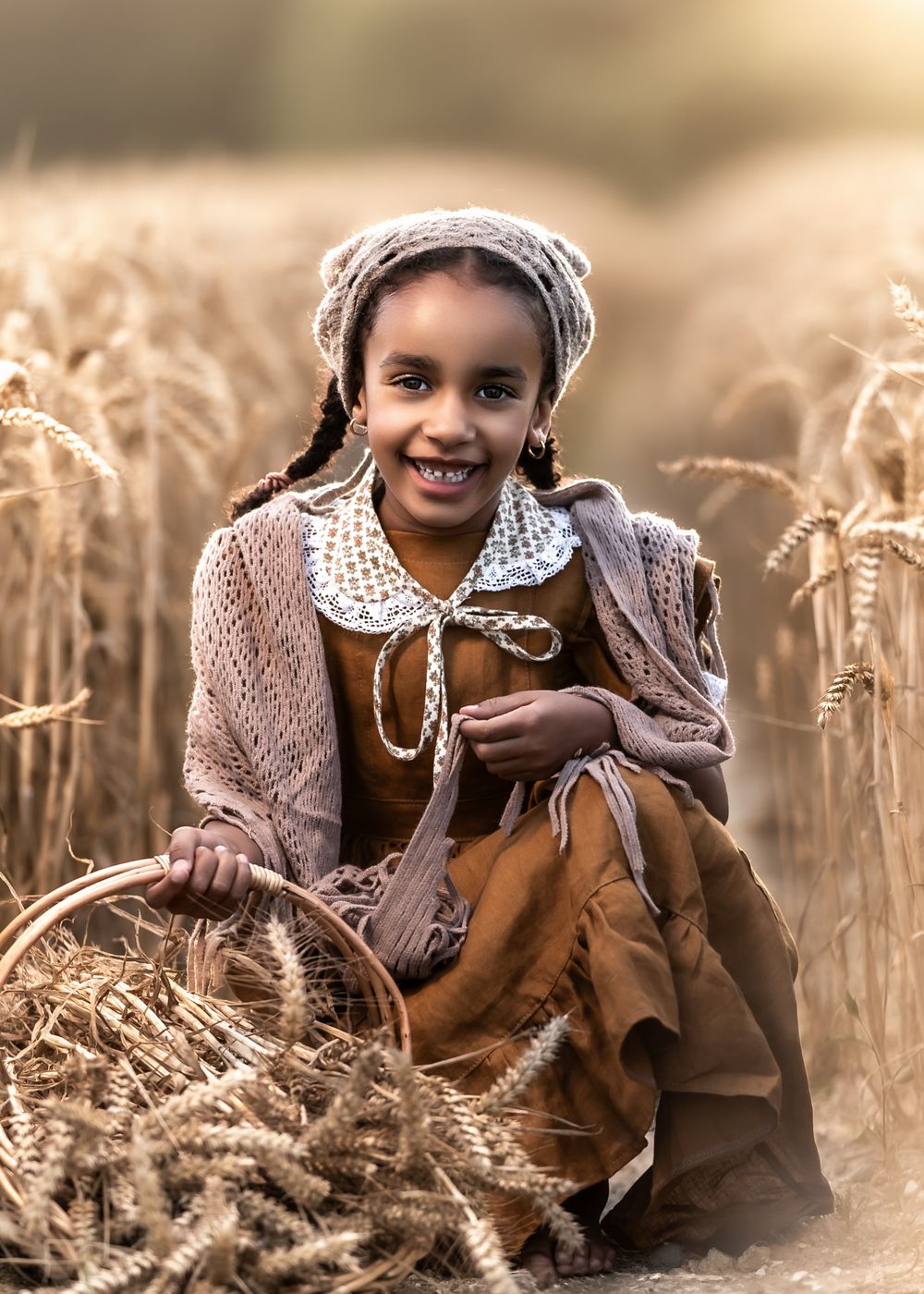 Vintage-styled portrait in wheat field with traditional dress and accessories.