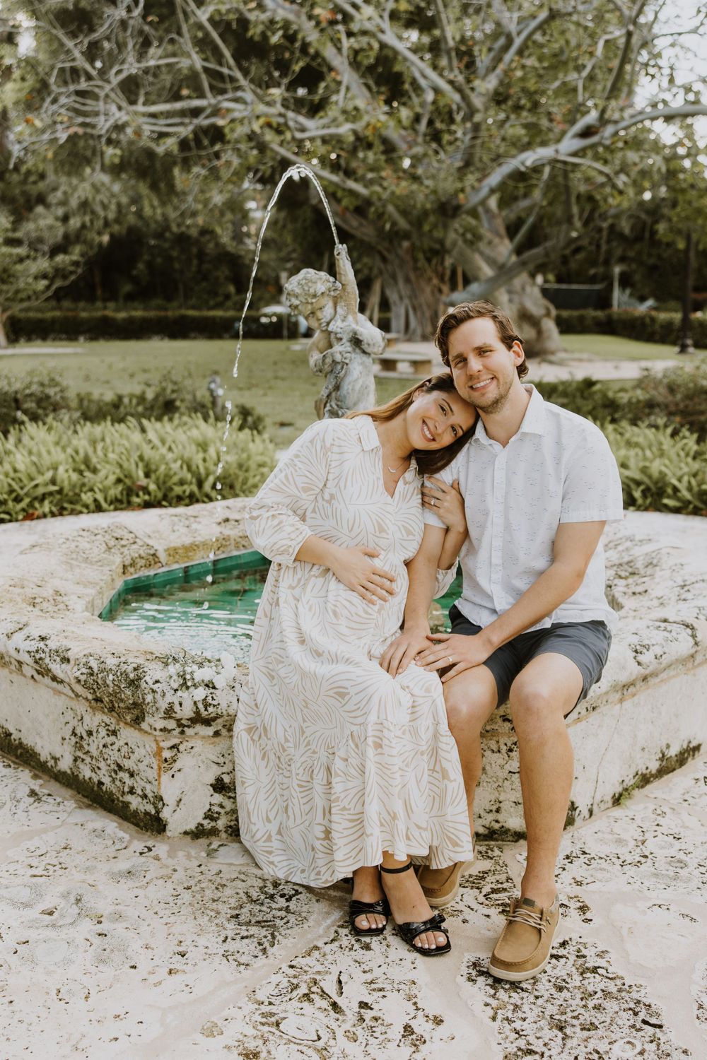 Golden Hour Maternity Session in Palm Beach, Florida captured by Lindsay McDow Photography featuring flowers, foliage, arches, and stairs