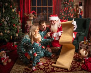 Cozy Christmas scene with decorated tree and presents in traditional holiday setting.