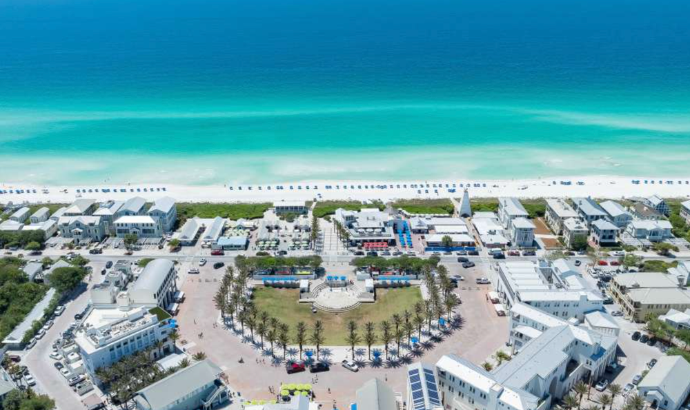 Aerial panoramic collage of beachfront resorts and turquoise waters along a pristine coastline.