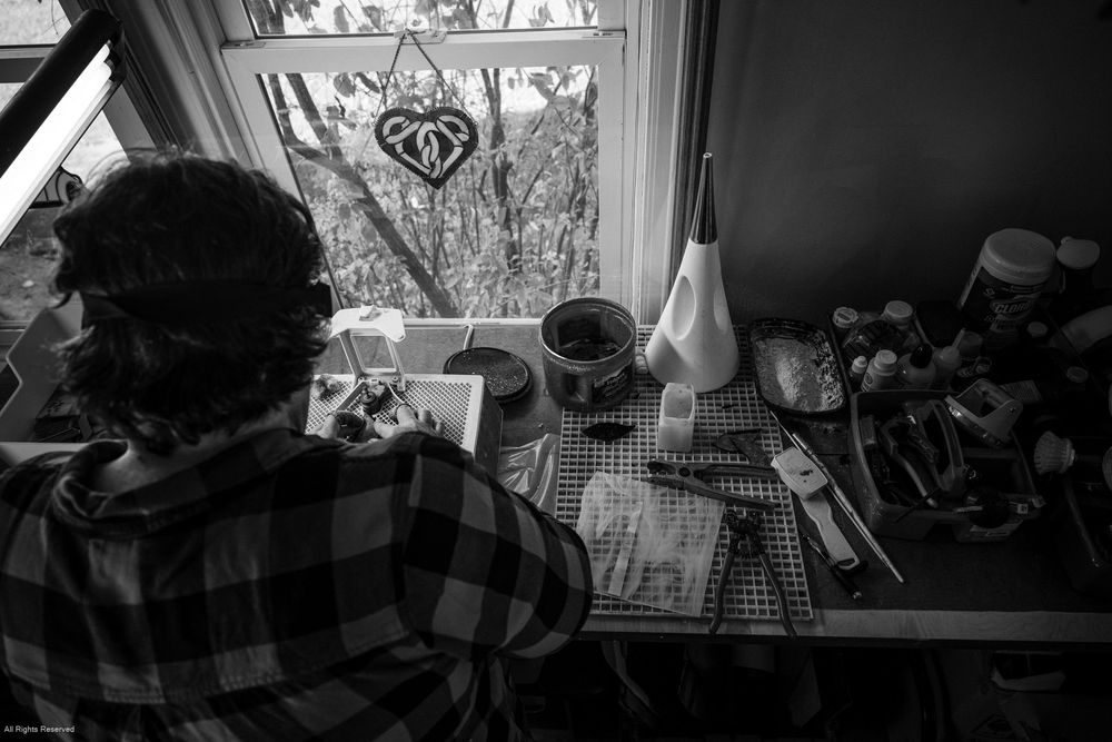 A black and white montage of windows and interior scenes showing different perspectives of a home.