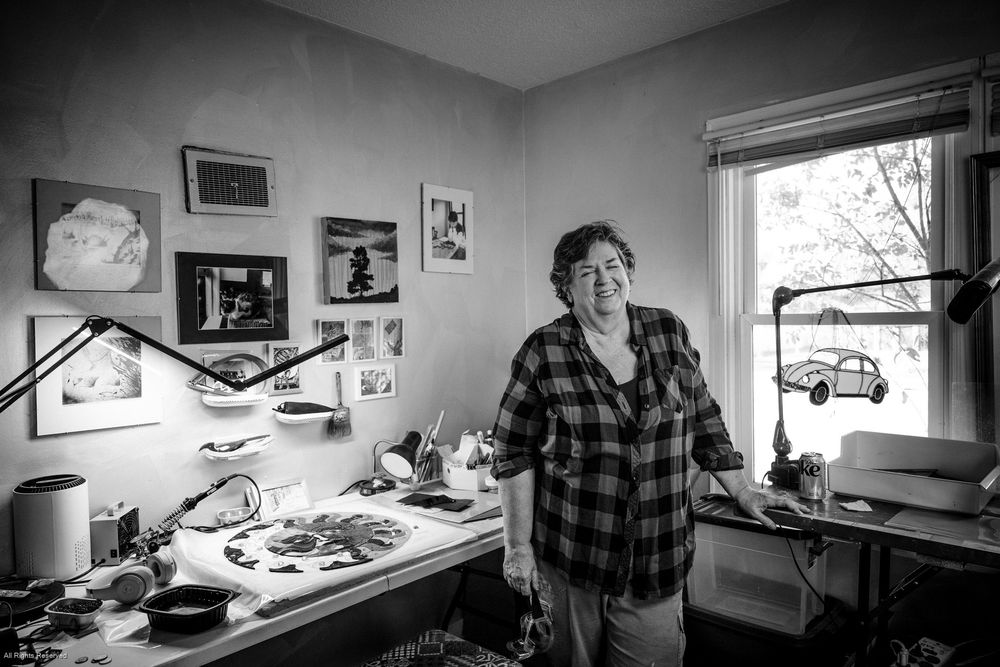 A black and white photo sequence shows someone working at a desk with drawings and illustrations on the wall.