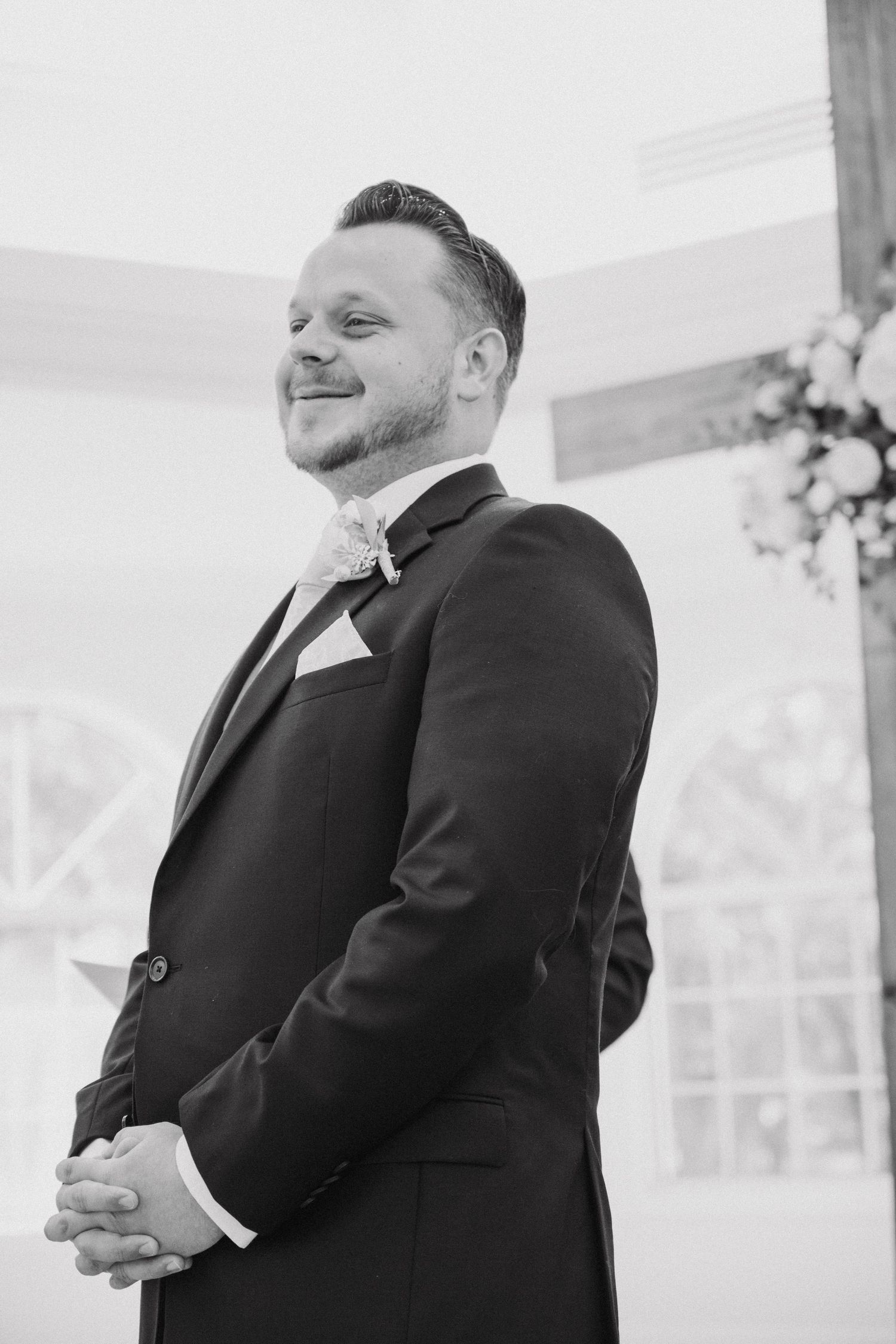 Black and white candid shots of emotional reactions during a wedding ceremony.