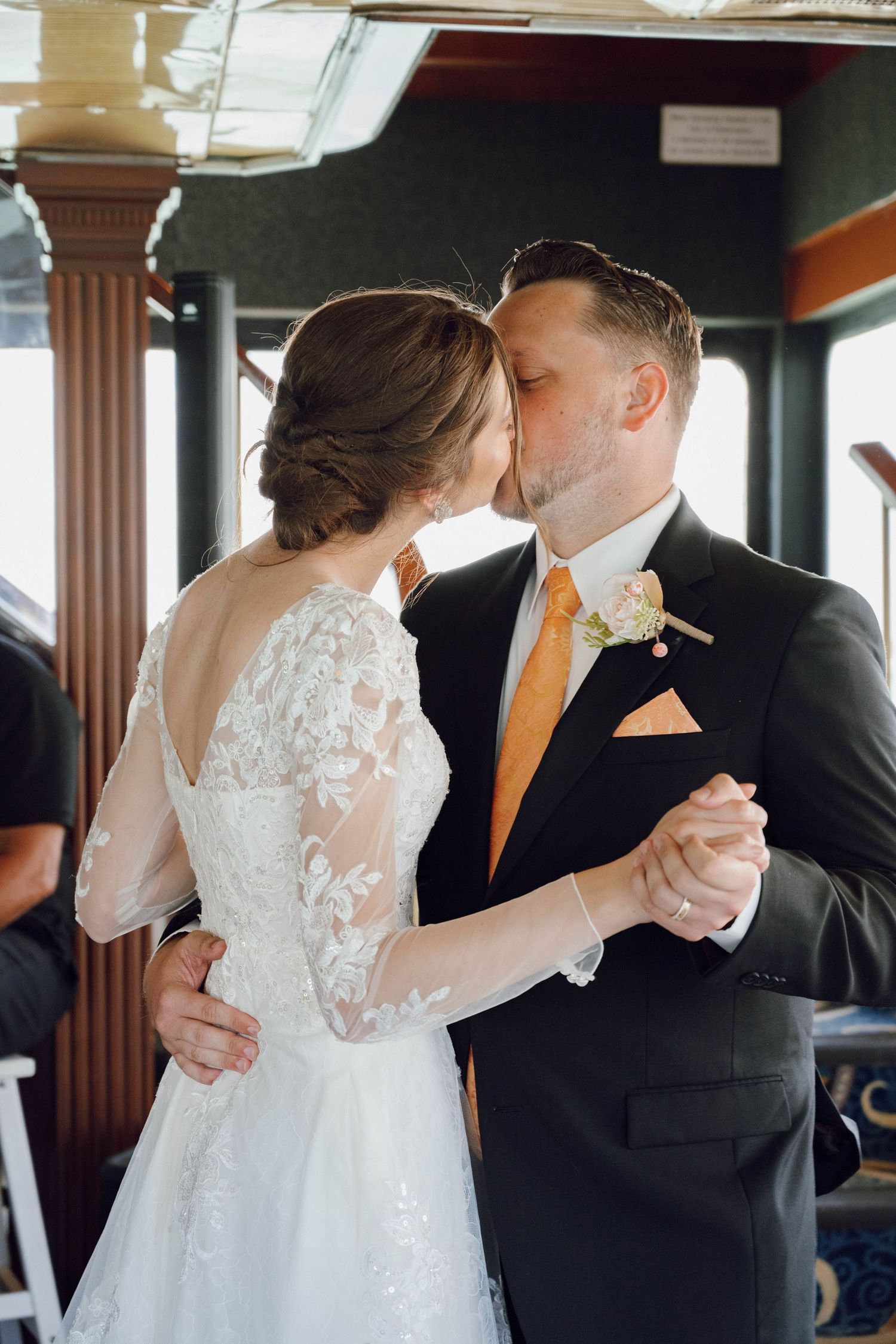 Romantic wedding sequence showing tender moments between newlyweds in formal attire.