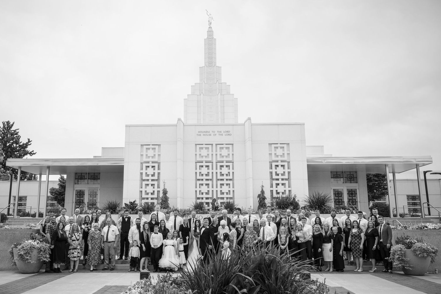 Wedding day family photo outside the Idaho Falls LDS Temple.
