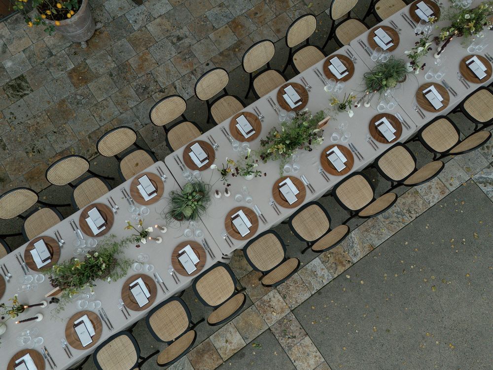 Aerial view of empty chairs arranged in rows for an outdoor ceremony.