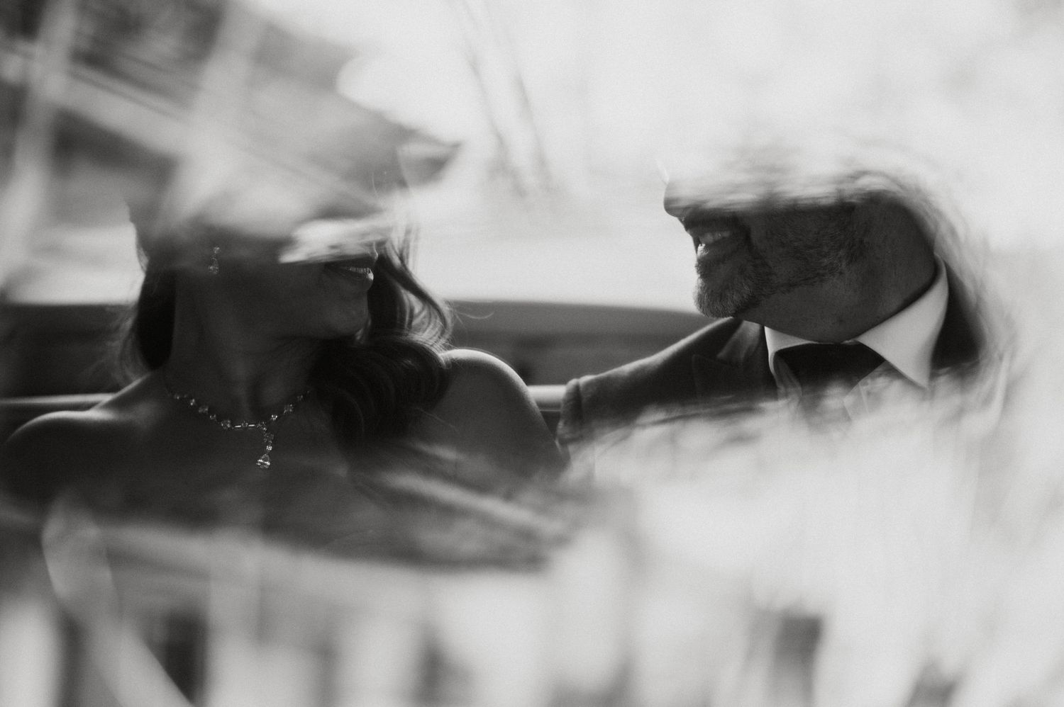Abstract black and white wedding photos with artistic motion blur effects.