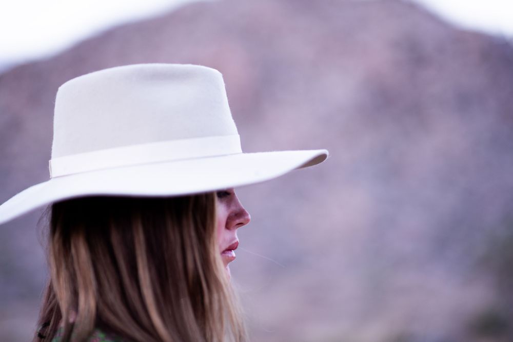 Artistic portrait photography for women in Joshua Tree, focused on presence, self-witnessing, and natural desert light. Grounded, intentiona