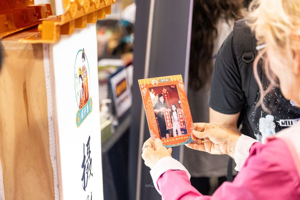 Lively New Year Hanfu market stall event photography capturing cultural portraits and interactions, by an Auckland photographer.