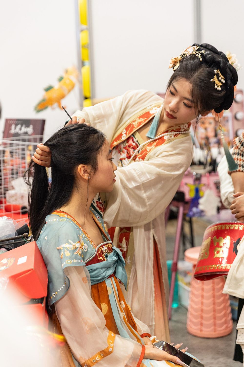 Lively New Year Hanfu market stall event photography capturing cultural portraits and interactions, by an Auckland photographer.