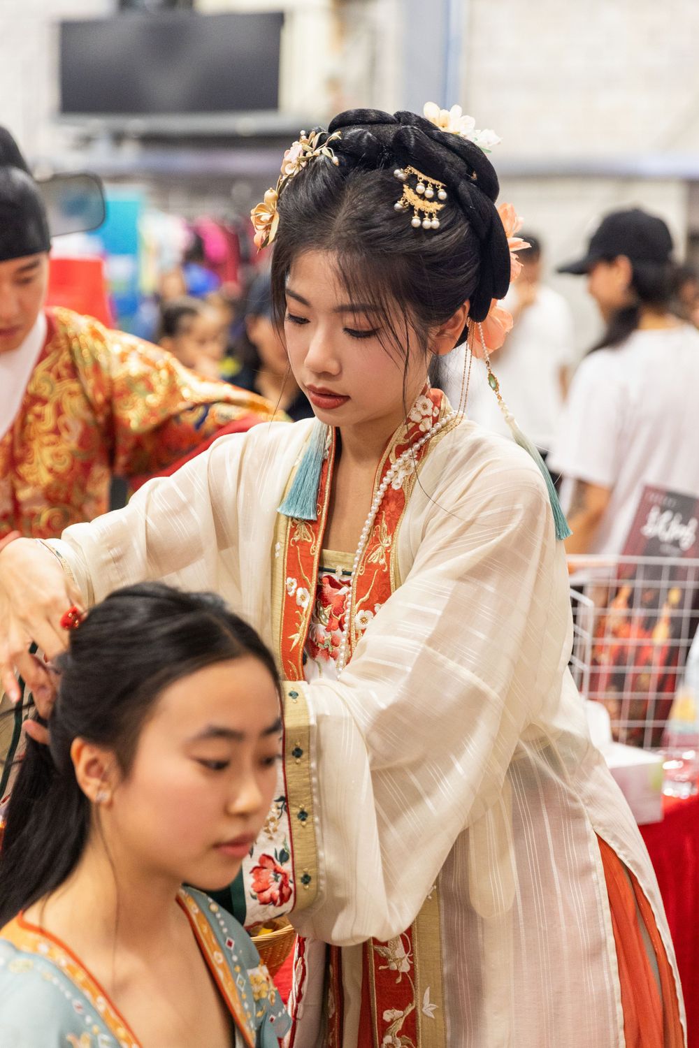 Lively New Year Hanfu market stall event photography capturing cultural portraits and interactions, by an Auckland photographer.
