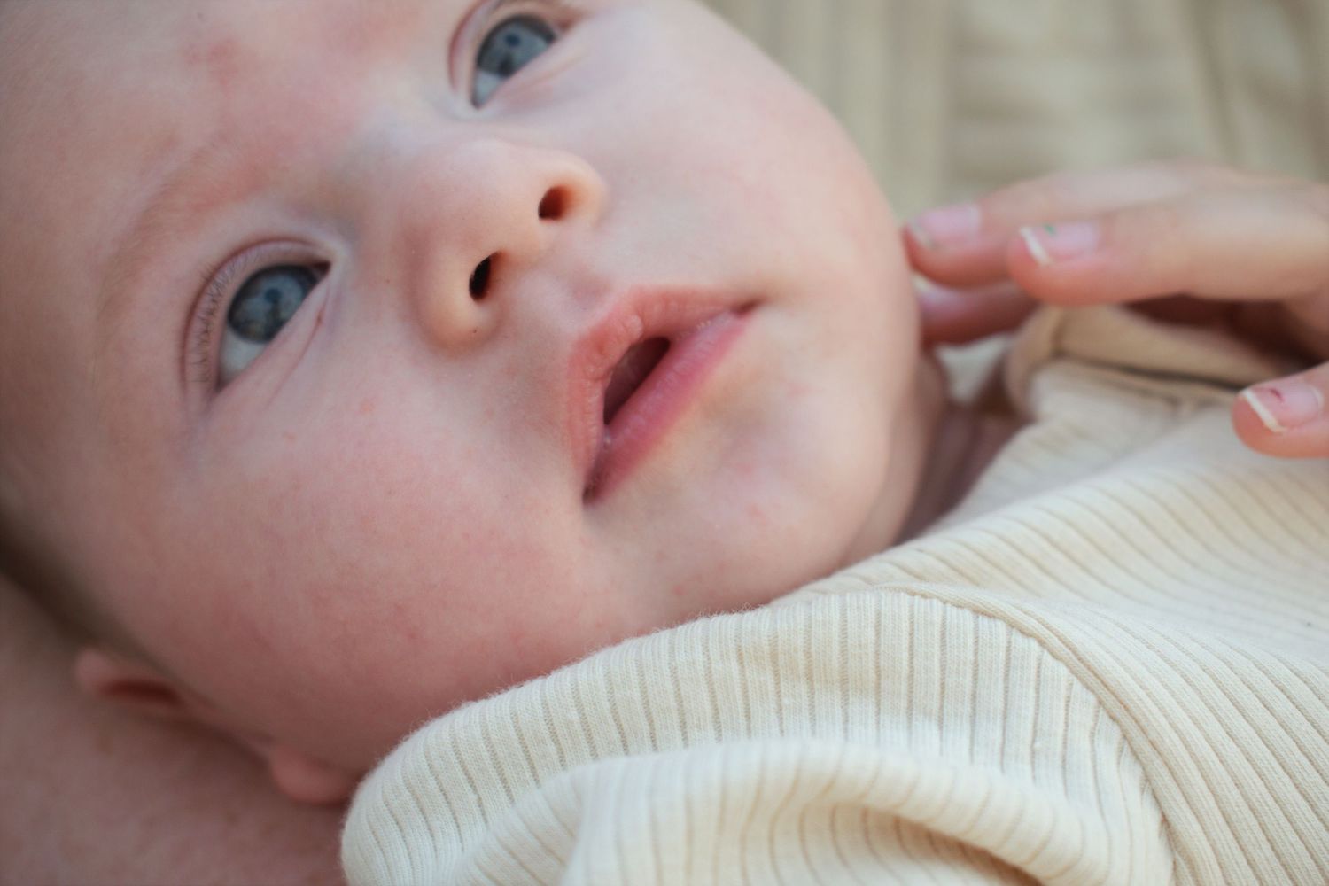 Newcastle Newborn baby Photographer captured baby lips, tiny nose, and blue eyes