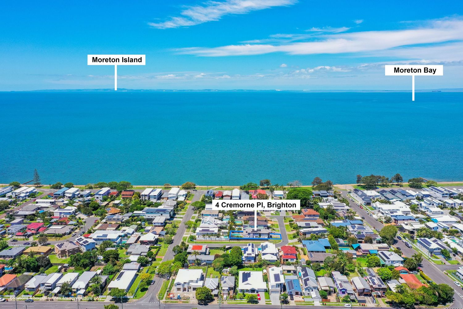 Aerial view of Brighton suburb with Moreton Island and Moreton Bay visible beyond coastal residential streets.
