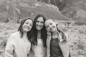A series of black and white photos showing people posing together outdoors in a desert landscape setting.