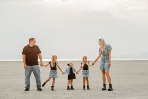 A series of six photos showing a family walking together on a white sandy beach at sunset.