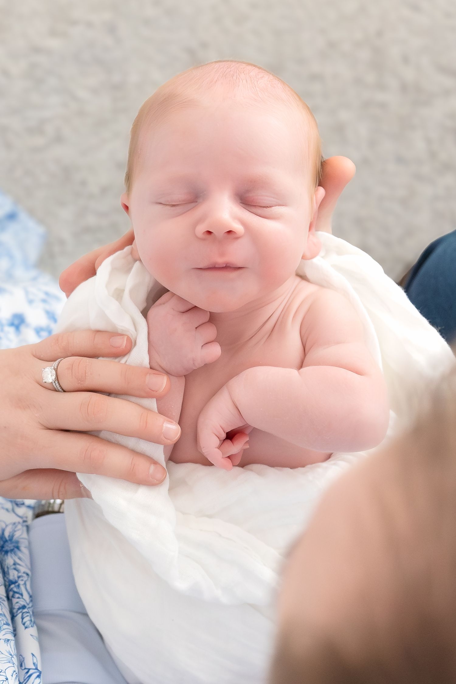 Newborn baby George sleeping during an in-home lifestyle newborn photography session in Jefferson Georgia.