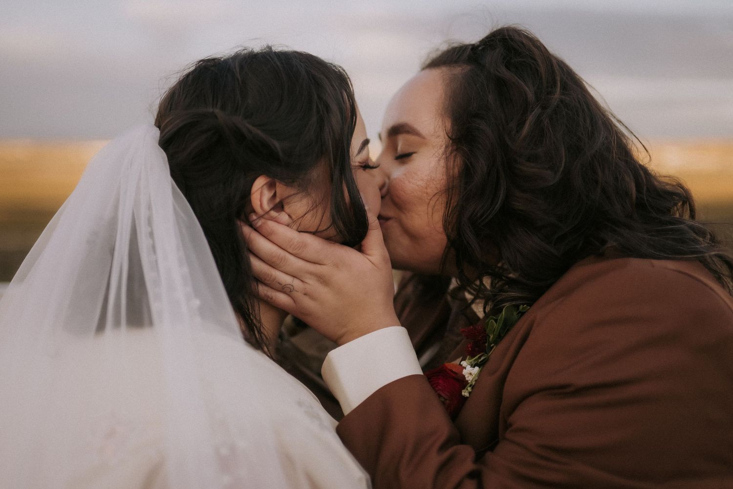 A series of romantic wedding photos of a couple sharing a kiss during sunset in albuquerque New Mexico. LGBTQ wedding photographer in abq.