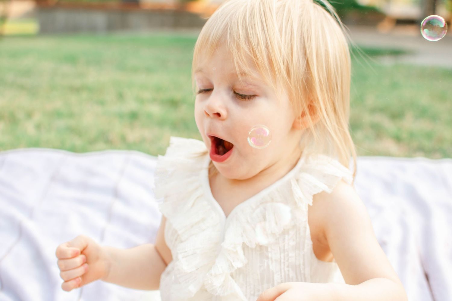 A sequence of playful expressions and reactions captured in natural lighting outdoors.