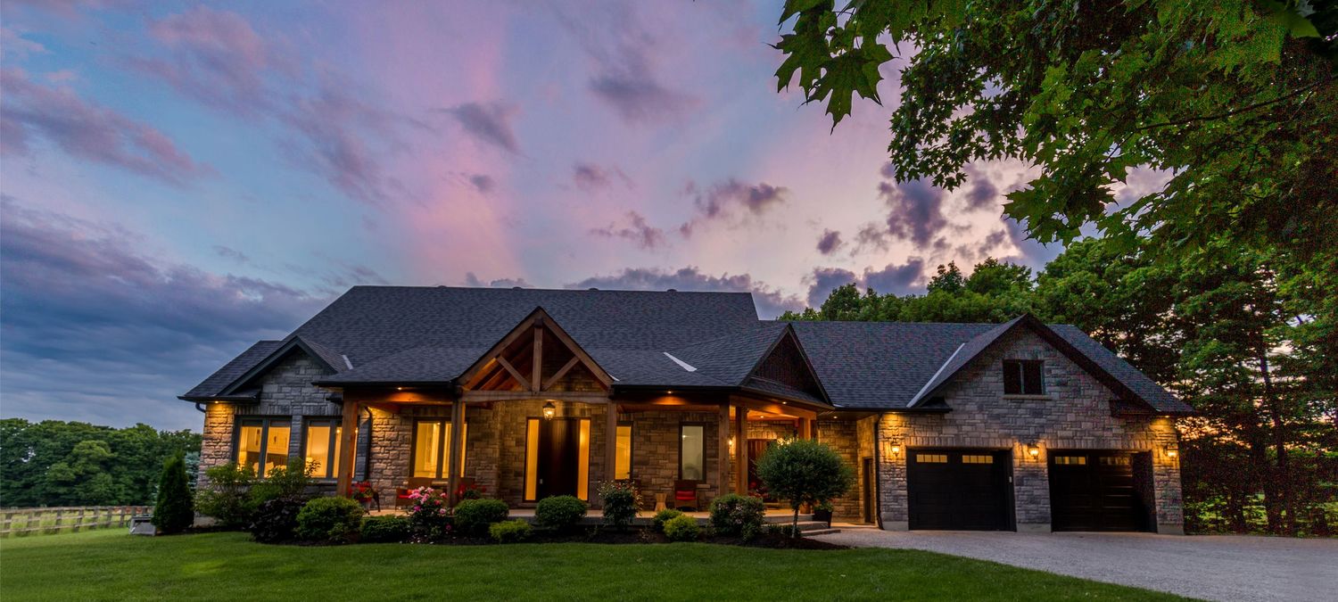 An exterior photo of a beautiful home in Hillsdale On at sunset, photographed by Sarah Tennant for an real estate listing