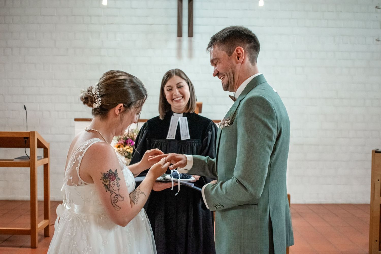 Newlyweds share a slice of wedding cake during their reception.