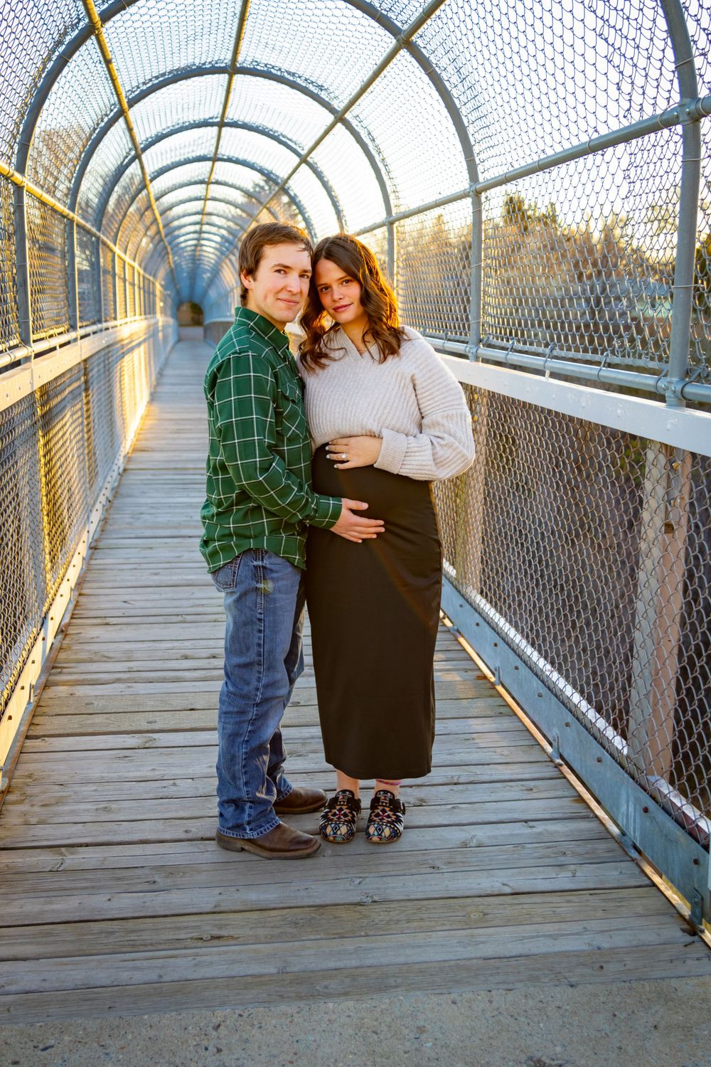 a couple together on a bridge.