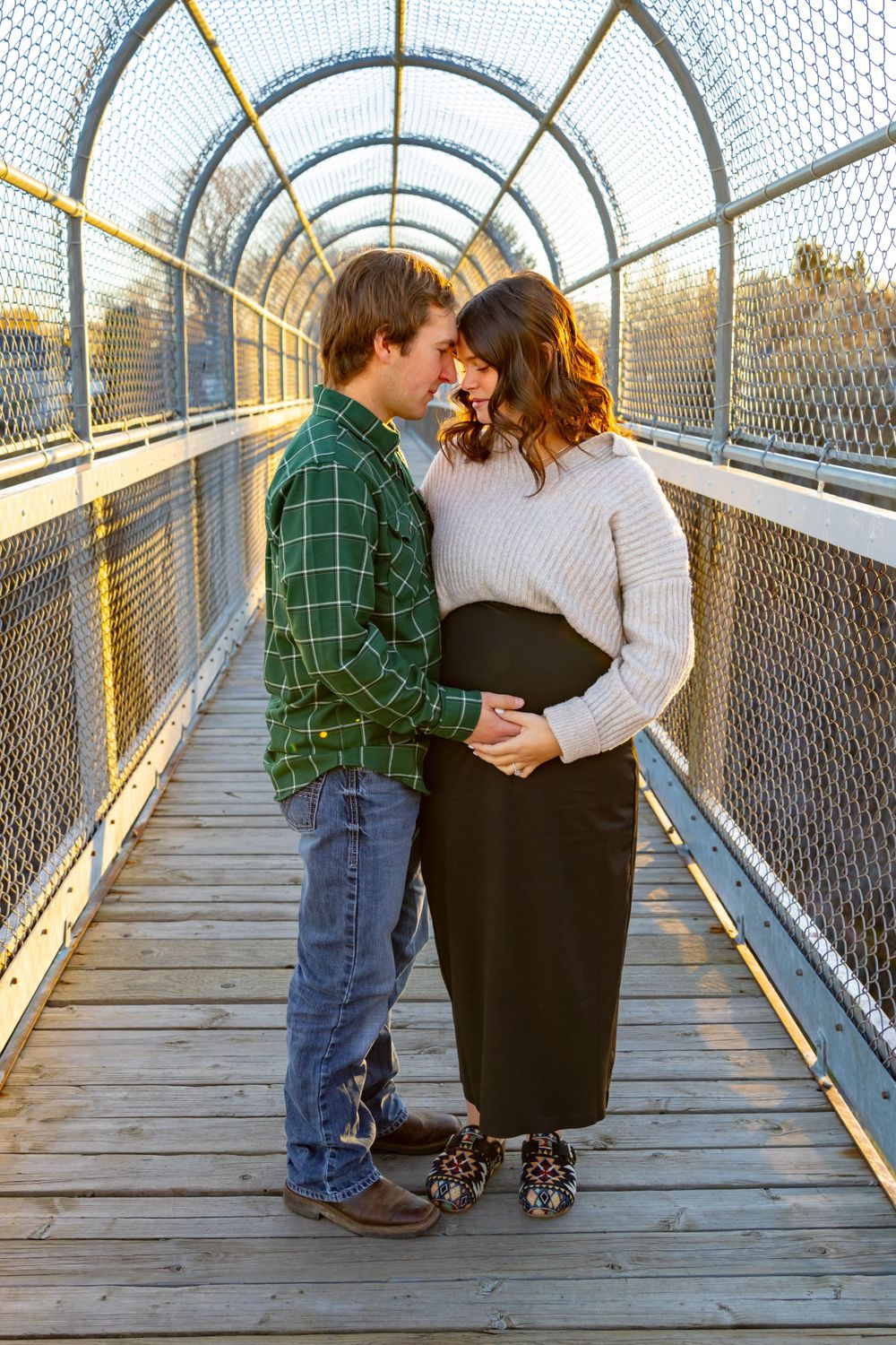 a couple together on a bridge.